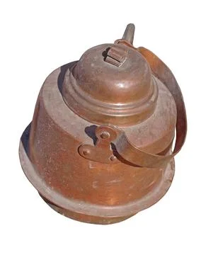 Old copper kettle on white Stock Photos