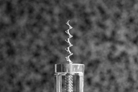 Old corkscrew on abstract background. Stock Photos