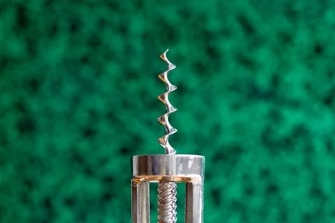 Old corkscrew on abstract background. Stock Photos