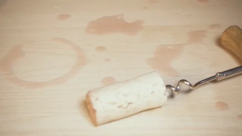 Old Corkscrew on the table with traces of wine Stock Footage 87988660