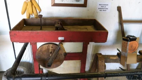 Old corn sheller and various tools used on the farm Stock Footage 113938779
