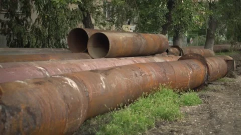 Old Corroded Water Utility Pipes Scattered on the Ground 스톡 동영상 343894962
