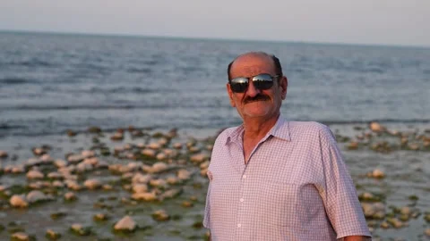 Old couple on the beach Stock Footage 313822641