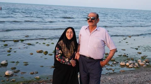Old couple on the beach Stock Footage 313822650
