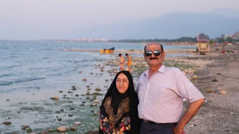 Old couple  on the beach Stock Footage 313822652