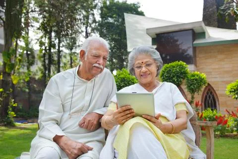 Old couple with a digital tablet Stock Photos