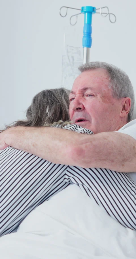 Old couple, hug and support in hospital, discussion and compassion for elderly Stock Footage 340881152