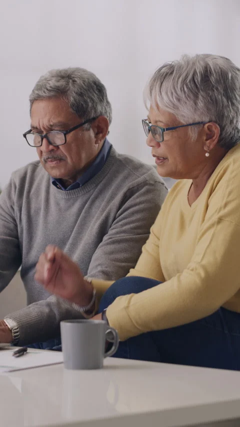 Old couple, laptop and documents for finance in home with notes, glasses or Stock Footage 329854244