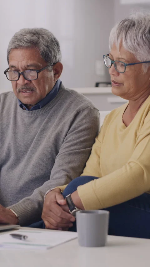 Old couple, laptop and documents for taxes in home with discussion, confused and Stock Footage 330103817
