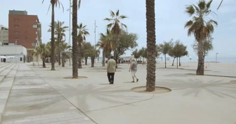 Old couple passing by the beach Stock Footage 171175693