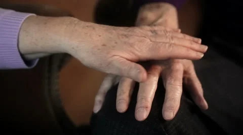 Old couple playing with hands Stock Footage 48295324
