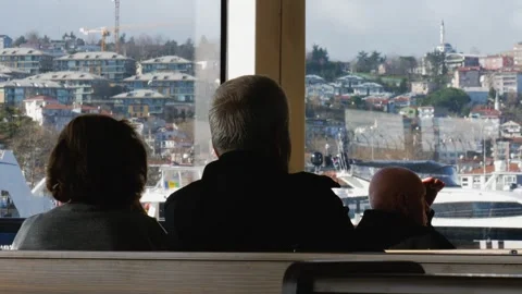 An old couple sitting next to each other and enjoying a Bosporus tour Stock Footage 265488697