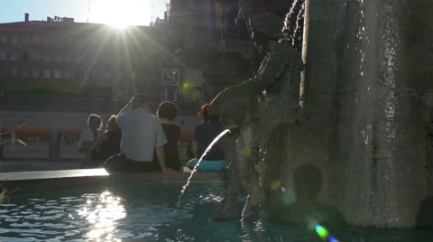 Old couple sitting next to water fountain Marienplatz Munich Stock Footage 50975290