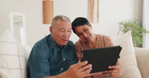 Old couple, tablet and video call on sofa, smile and bonding online with Stock Footage 254942006