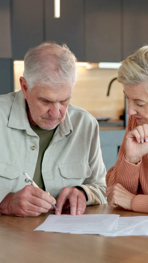 Old couple, writing and document in home with contract, signature and statement 库存影片 337496618