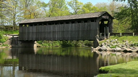 Old covered bridge over river Stock Footage 710452