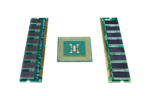 An old CPU and two modules of RAM isolated on white. Stock Photos