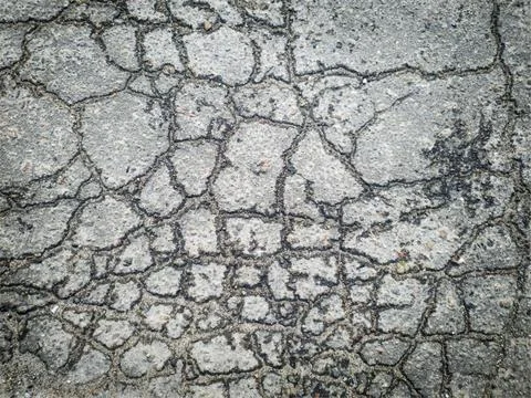 Old cracked asphalt, great vector grunge background created by nature Stockillustratie