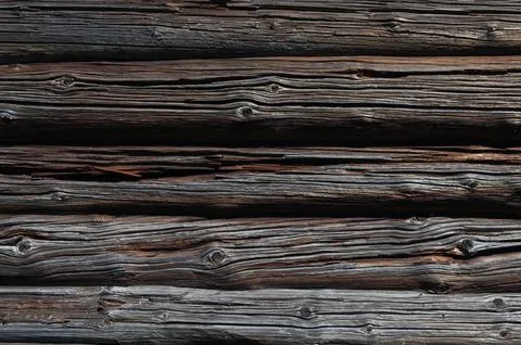 Old cracked log wall background Stock Photos