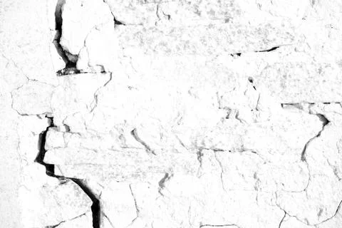 Old cracked plaster wall with lines of broken plastering due to age and decay Stock Photos