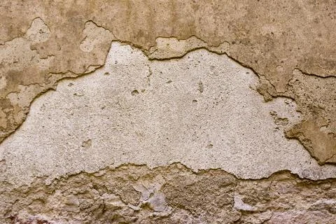 Old cracked rough wall with plaster crumbled Stock Photos
