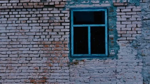 Old cracked wall with a blue window Video stock 73669701