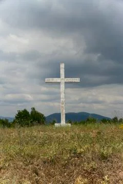 Old cross in the field. Stock Photos