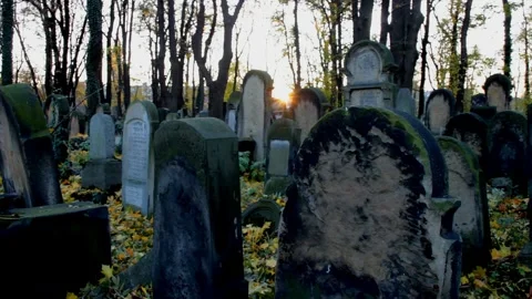 Old Cross shaped Grave stone cemetery Stone crosses on grave in a cemetery a Stock Footage 334646278