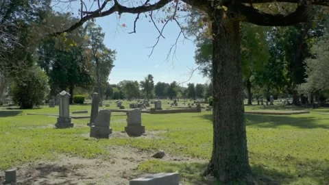 Old Cross shaped Grave stone cemetery Stone crosses on grave in a cemetery a Stock Footage 334646286