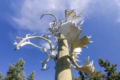 Old Crow, Canada. Horizontal view of Native american indian totem pole Stock Photos
