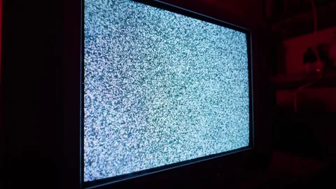 Old Crt Television Screen Displaying Static Noise in Dark Room with Red Lighting Stock Footage 335634041