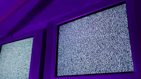 Old Crt Televisions Displaying Static Noise in Purple Neon Light Room Stock Footage 335633647