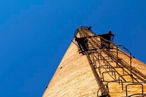 Old crumbling pipe made of bricks. Stock Photos