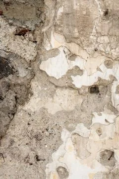 Old crumbling wall texture with damaged plaster Fotos de archivo