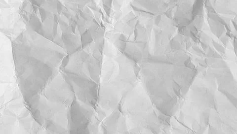 Old crumpled paper sheet with torn edges and weathered texture. Blank white.. Stock Photos