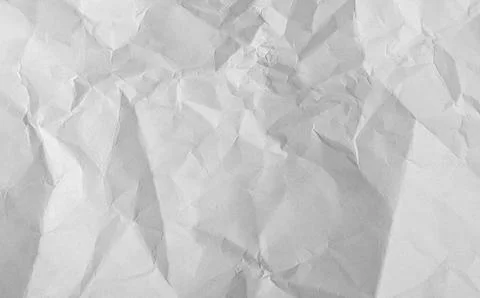 Old crumpled paper sheet with torn edges and weathered texture. Blank white.. Stock Photos