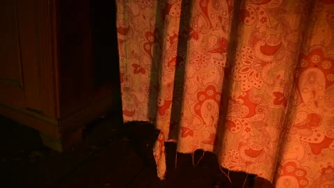 Old curtains in a draft in the light of a flame Stock Footage 138145874