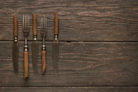 Old cutlery on the table Stock Photos