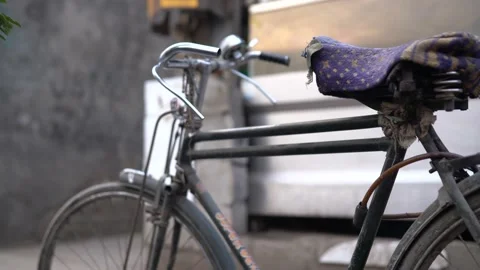 An old cycle standing in bus yard Stockbeeldmateriaal 194429559