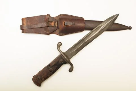 Old dagger with a worn leather sheath Stock Photos