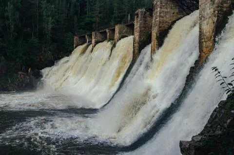 Old dam on a mountain river Stock Photos