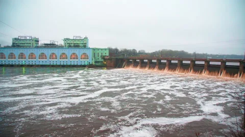 The old dam on the river generates electricity moving up Stock Footage 168816569