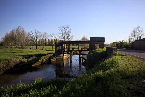 Old dam on a stream of water Stock Photos