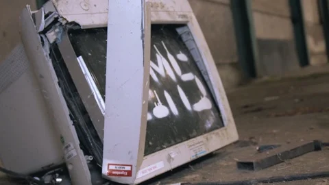 An old damaged computer screen in an abandonded lost factory Vídeos de archivo 97454436