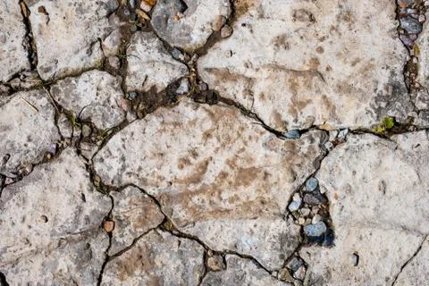 Old damaged concrete rough surface with cracks Stock Photos