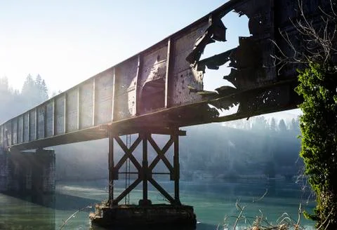 Old damaged train bridge over the river Drava Stock Photos