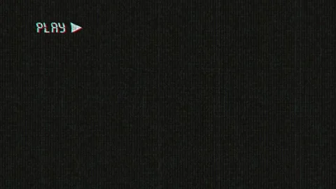 Old damaged VHS tape playing, over noise from an analog TV, with a PLAY text. Stock Footage 209332576