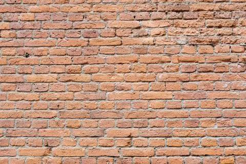 Old damaged worn brick wall background Stock Photos