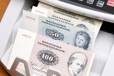 Old Danish krone in the counting machine Stock Photos