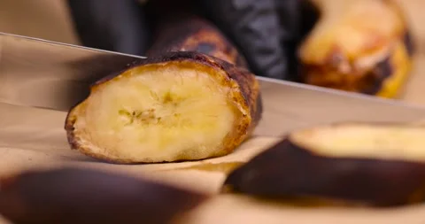 An old dark banana in close-up, an overripe dark banana that is spoiling Stock Footage 271006830